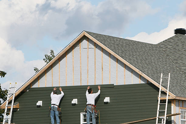 Professional Storm Damage Siding Repair technician working in Bradley, IL